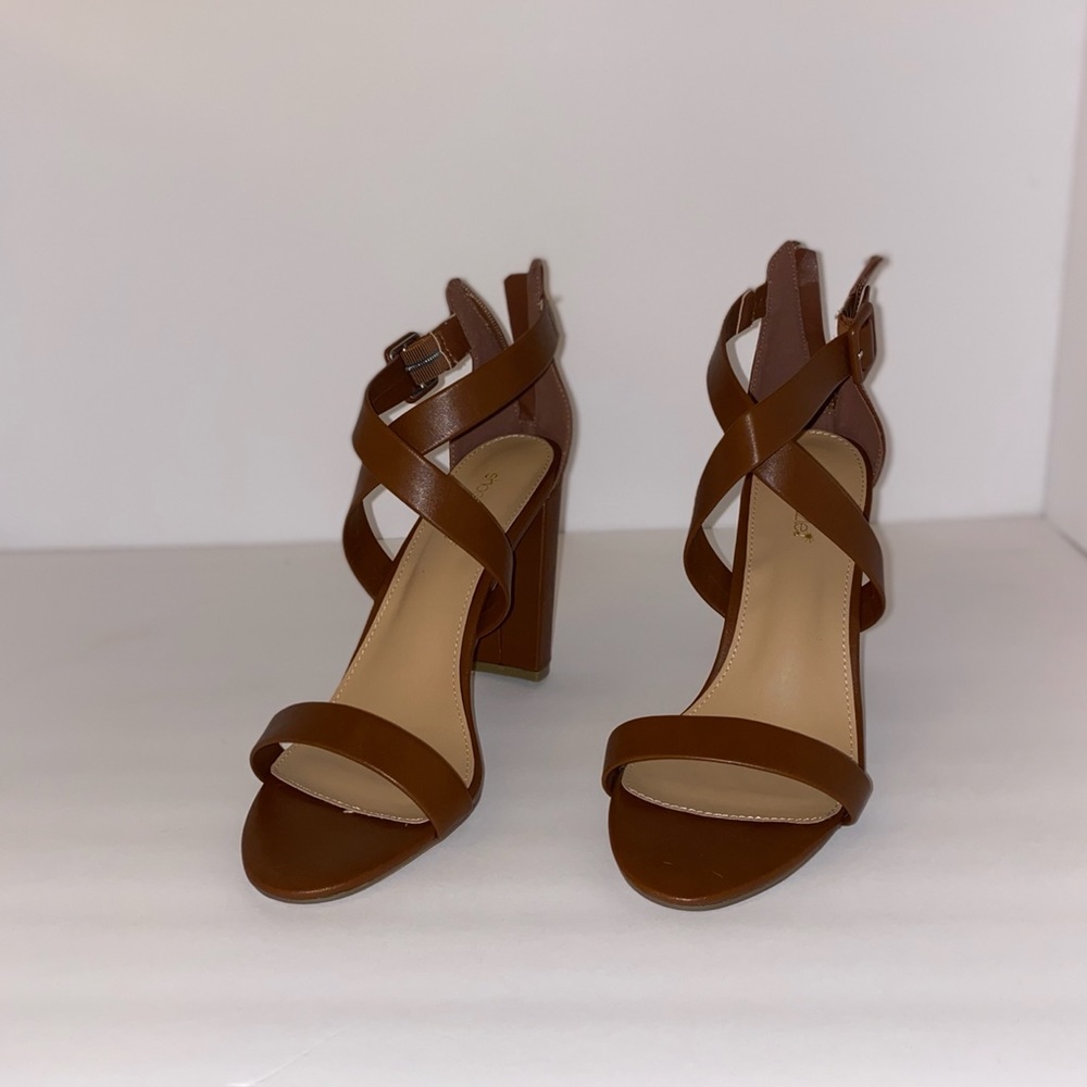 Brown heeled sandals.